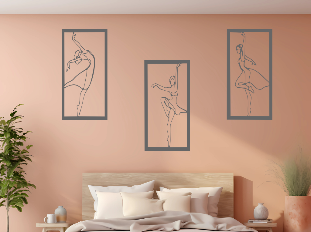 Metal wall art set featuring three minimalist ballerina silhouettes in various elegant dance poses, finished in Berry Grey Gloss powder coating, mounted on a light peach wall above a bed, adding a graceful and artistic touch to the bedroom