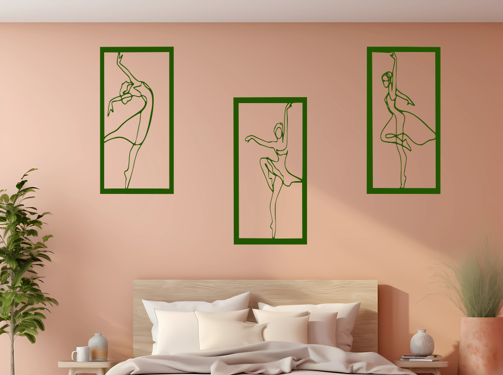 Metal wall art set featuring three minimalist ballerina silhouettes in various elegant dance poses, finished in Mistletoe powder coating, mounted on a light peach wall above a bed, adding a graceful and artistic touch to the bedroom.