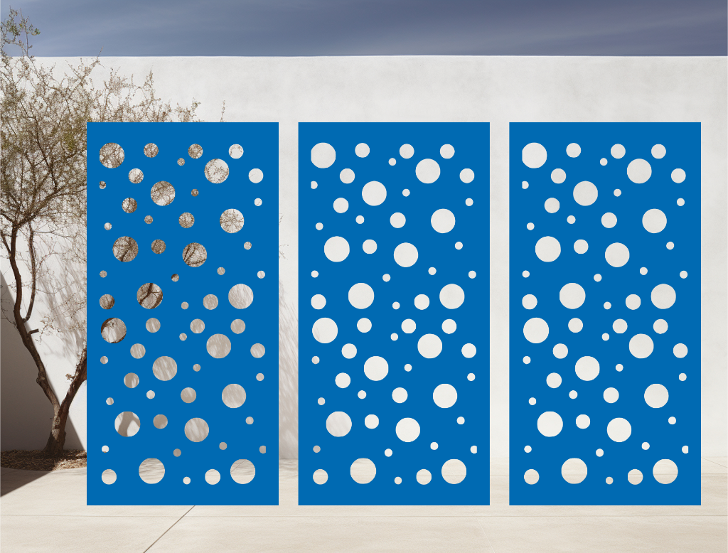 Metal privacy screen with a modern bubble pattern of varying circle sizes, finished in Blaze Blue Gloss powder coating, displayed outdoors against a white wall, providing both privacy and an artistic element to the space.