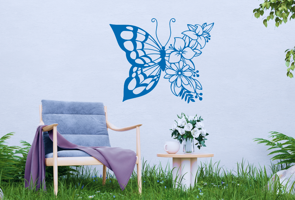 Metal wall art featuring a butterfly design with one wing made of floral patterns, finished in Blaze Blue Gloss powder coating, mounted on an outdoor wall, adding a whimsical and nature-inspired touch to a cozy garden seating area.