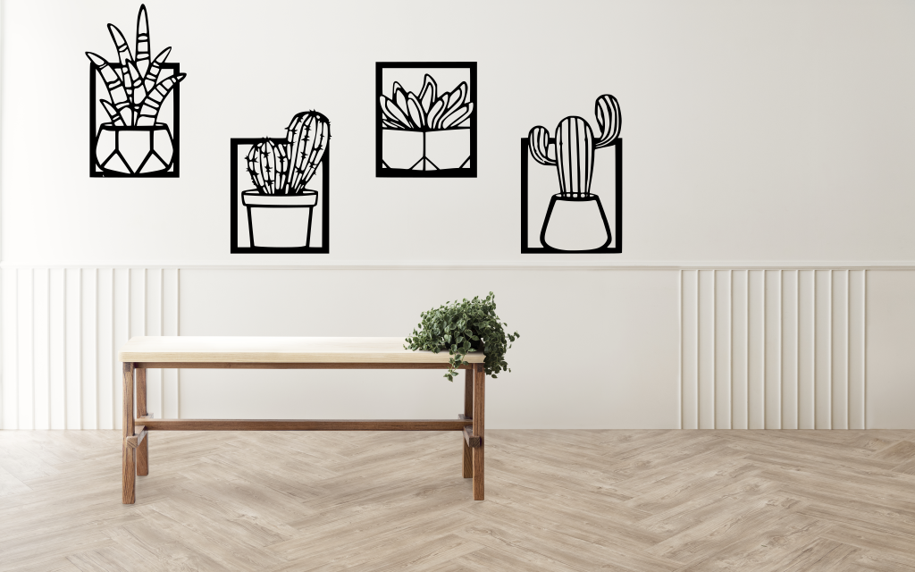 Metal wall art set featuring four distinct cactus designs in minimalist frames, finished in Night Sky Matt Black powder coating, creating a modern, playful touch to a neutral-toned interior space with a light wooden bench and soft lighting.