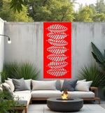 Palm Cascade privacy screen in Signal Red, presenting a vibrant red finish and layered palm leaf design, perfect for adding bold privacy and a tropical feel to outdoor decor