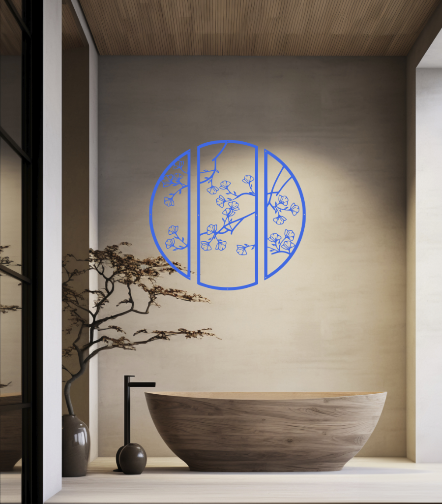 Metal wall art featuring a circular design divided into three panels with intricate cherry blossom branches, finished in Blaze Blue Gloss powder coating, mounted on a light wall in a modern, minimalist bathroom, adding a serene and nature-inspired touch to the space.