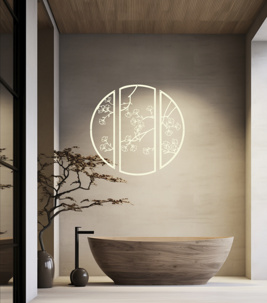 Metal wall art featuring a circular design divided into three panels with intricate cherry blossom branches, finished in Canola Cream powder coating, mounted on a light wall in a modern, minimalist bathroom, adding a serene and nature-inspired touch to the space.