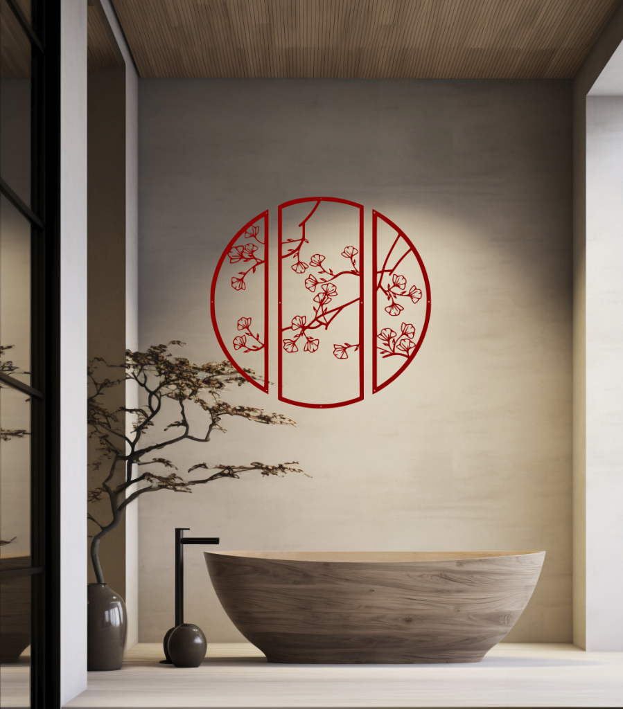 Metal wall art featuring a circular design divided into three panels with intricate cherry blossom branches, finished in Manor Red powder coating, mounted on a light wall in a modern, minimalist bathroom, adding a serene and nature-inspired touch to the space.