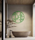 Metal wall art featuring a circular design divided into three panels with intricate cherry blossom branches, finished in Mistletoe powder coating, mounted on a light wall in a modern, minimalist bathroom, adding a serene and nature-inspired touch to the space.