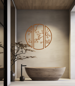 Metal wall art featuring a circular design divided into three panels with intricate cherry blossom branches, finished in Rust Patina powder coating, mounted on a light wall in a modern, minimalist bathroom, adding a serene and nature-inspired touch to the space.