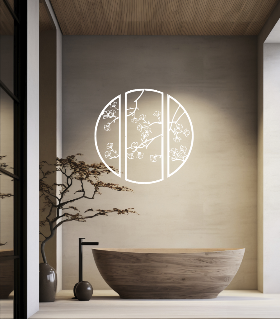 Metal wall art featuring a circular design divided into three panels with intricate cherry blossom branches, finished in Bright White Gloss powder coating, mounted on a light wall in a modern, minimalist bathroom, adding a serene and nature-inspired touch to the space.