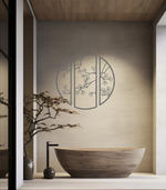 Metal wall art featuring a circular design divided into three panels with intricate cherry blossom branches, finished in Berry Grey Gloss powder coating, mounted on a light wall in a modern, minimalist bathroom, adding a serene and nature-inspired touch to the space.