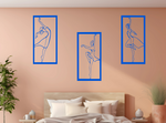 Metal wall art set featuring three minimalist ballerina silhouettes in various elegant dance poses, finished in Blaze Blue Gloss powder coating, mounted on a light peach wall above a bed, adding a graceful and artistic touch to the bedroom.