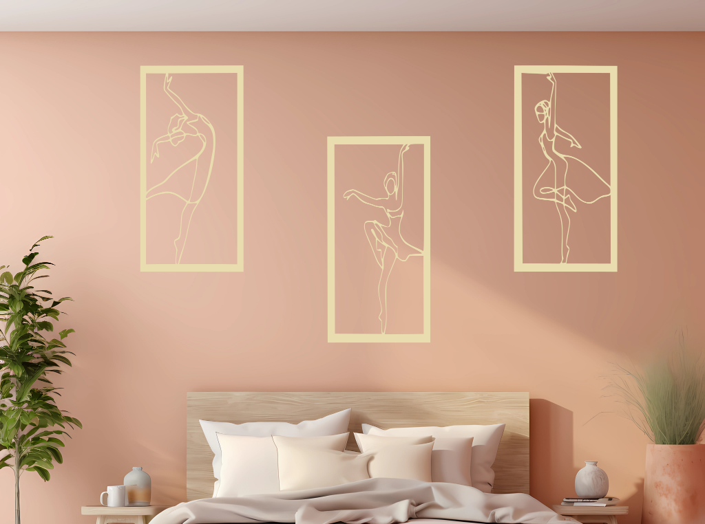 Metal wall art set featuring three minimalist ballerina silhouettes in various elegant dance poses, finished in Canola Cream powder coating, mounted on a light peach wall above a bed, adding a graceful and artistic touch to the bedroom.