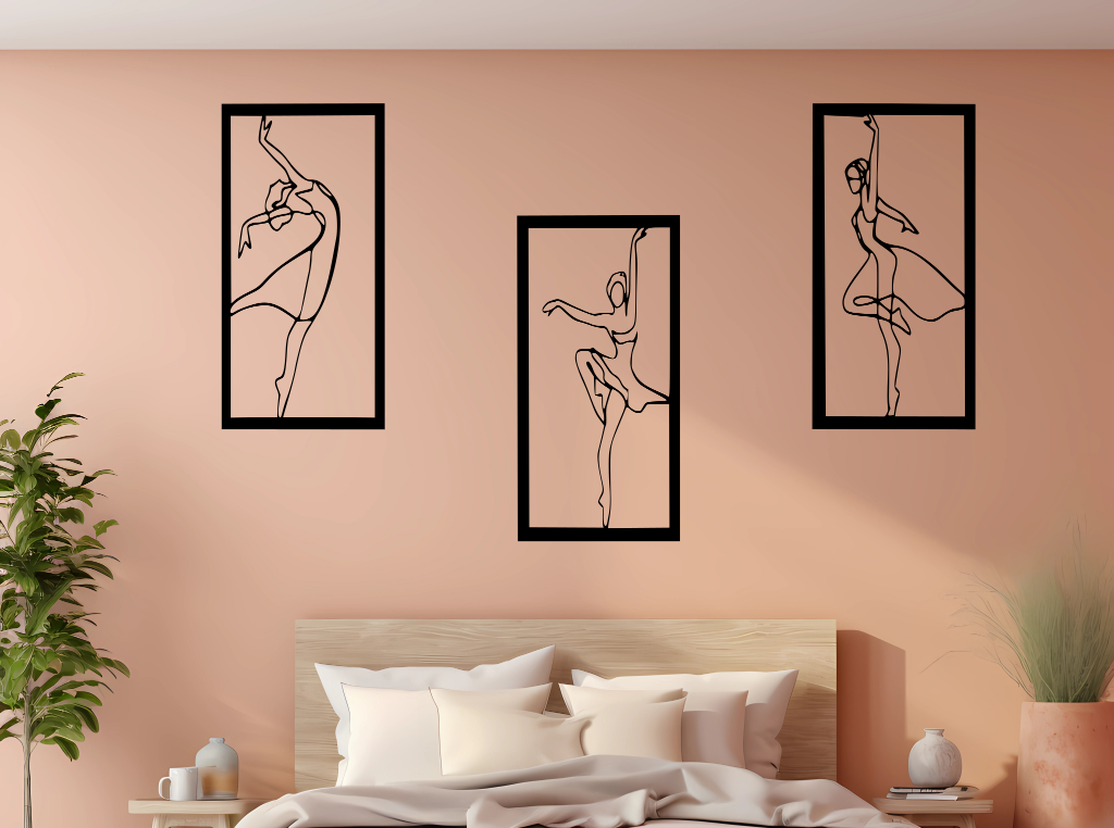 Metal wall art set featuring three minimalist ballerina silhouettes in various elegant dance poses, finished in Night Sky Matt Black powder coating, mounted on a light peach wall above a bed, adding a graceful and artistic touch to the bedroom