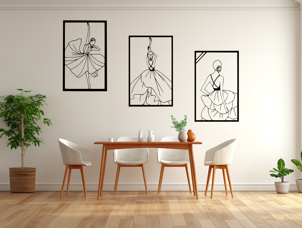 Metal wall art set featuring three minimalist line-drawing silhouettes of elegant flamenco dancers in flowing dresses, finished in Night Sky Matt Black powder coating, mounted on a white wall in a modern dining area with light wood furniture, adding a dynamic and artistic touch to the space.