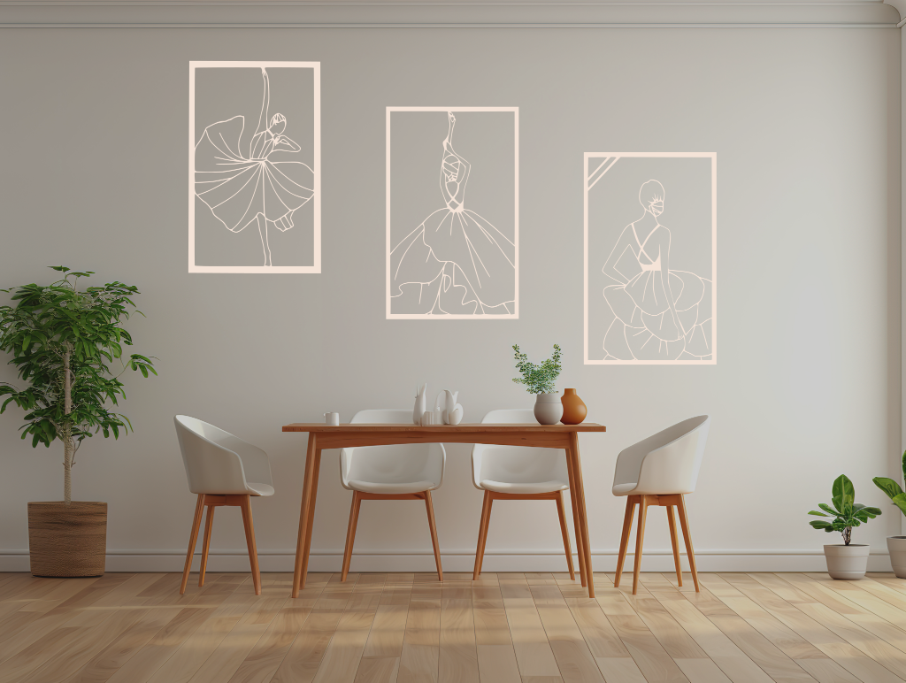 Metal wall art set featuring three minimalist line-drawing silhouettes of elegant flamenco dancers in flowing dresses, finished in Canola Cream powder coating, mounted on a white wall in a modern dining area with light wood furniture, adding a dynamic and artistic touch to the space.