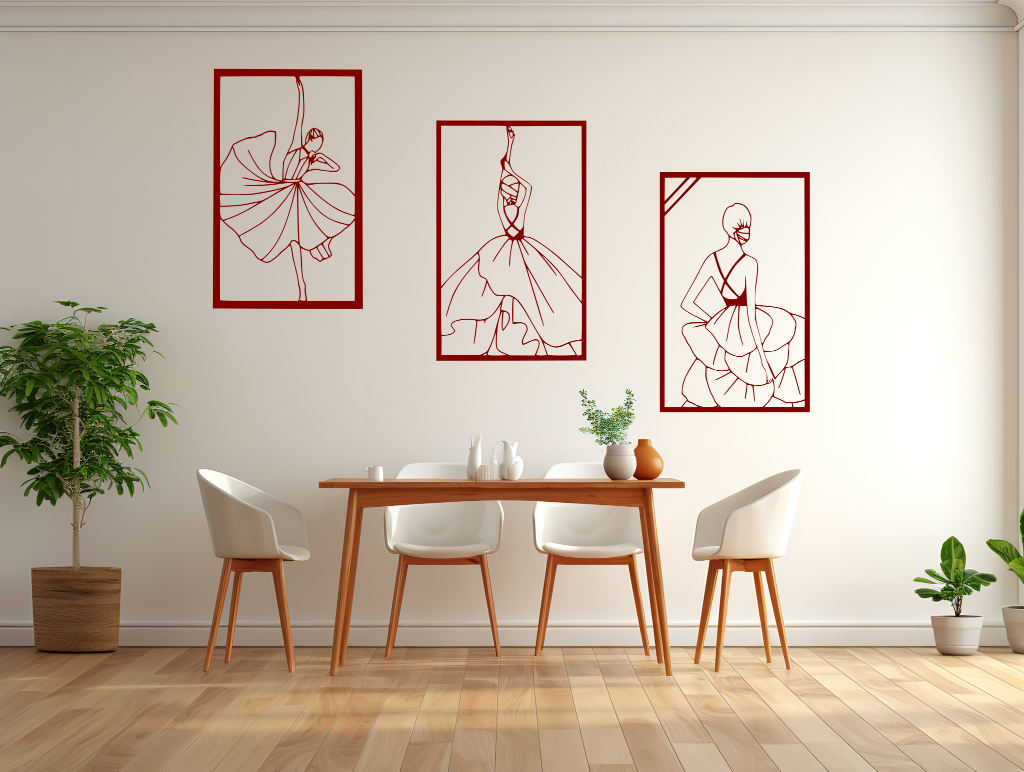 Metal wall art set featuring three minimalist line-drawing silhouettes of elegant flamenco dancers in flowing dresses, finished in Manor Red powder coating, mounted on a white wall in a modern dining area with light wood furniture, adding a dynamic and artistic touch to the space.