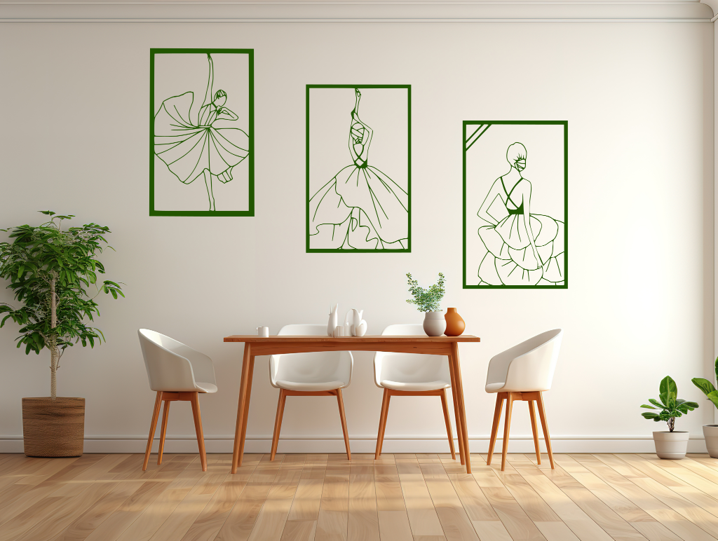 Metal wall art set featuring three minimalist line-drawing silhouettes of elegant flamenco dancers in flowing dresses, finished in Mistletoe powder coating, mounted on a white wall in a modern dining area with light wood furniture, adding a dynamic and artistic touch to the space.