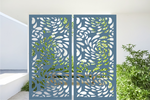 Metal privacy screen featuring a swirling droplet pattern, finished in Wedgwood Satin powder coating. The screen is displayed outdoors with green foliage visible through the cutout design, offering an elegant and organic element to any outdoor space.