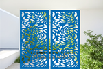 Metal privacy screen featuring a swirling droplet pattern, finished in Blaze Blue Gloss powder coating. The screen is displayed outdoors with green foliage visible through the cutout design, offering an elegant and organic element to any outdoor space.