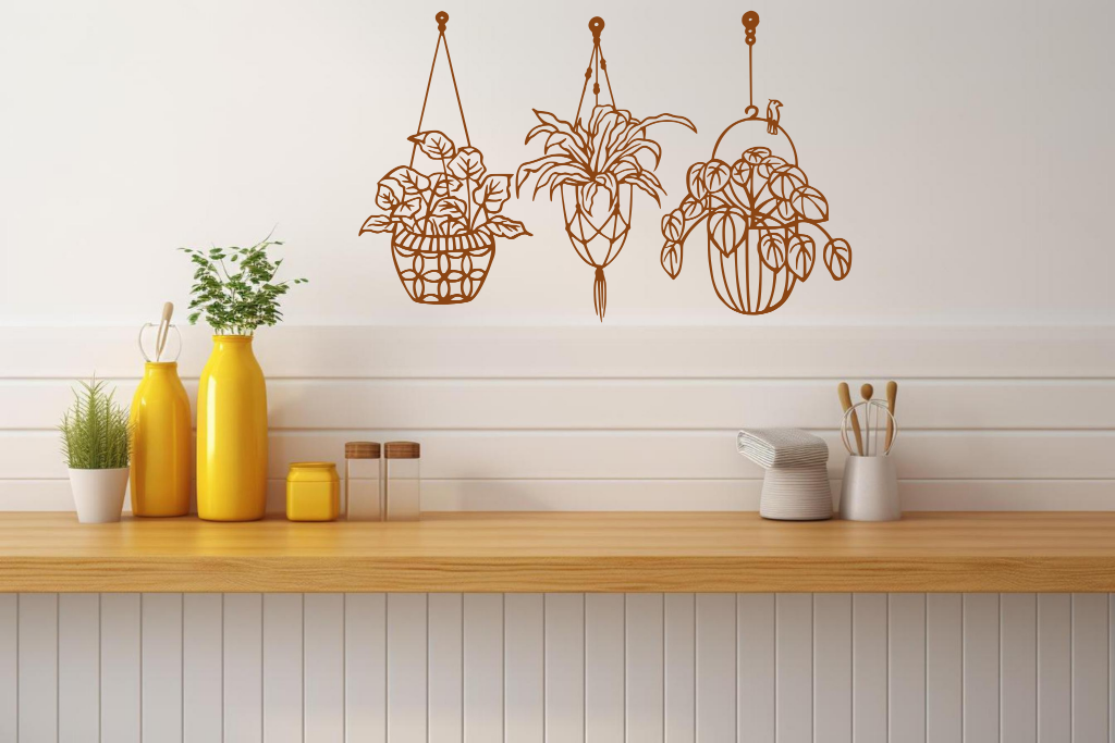 Metal wall art featuring three hanging planters with intricate plant designs, finished in Rust Patina powder coating, mounted on a kitchen wall. The piece brings a natural and modern aesthetic to the space, complementing the vibrant yellow decor elements on the counter below.