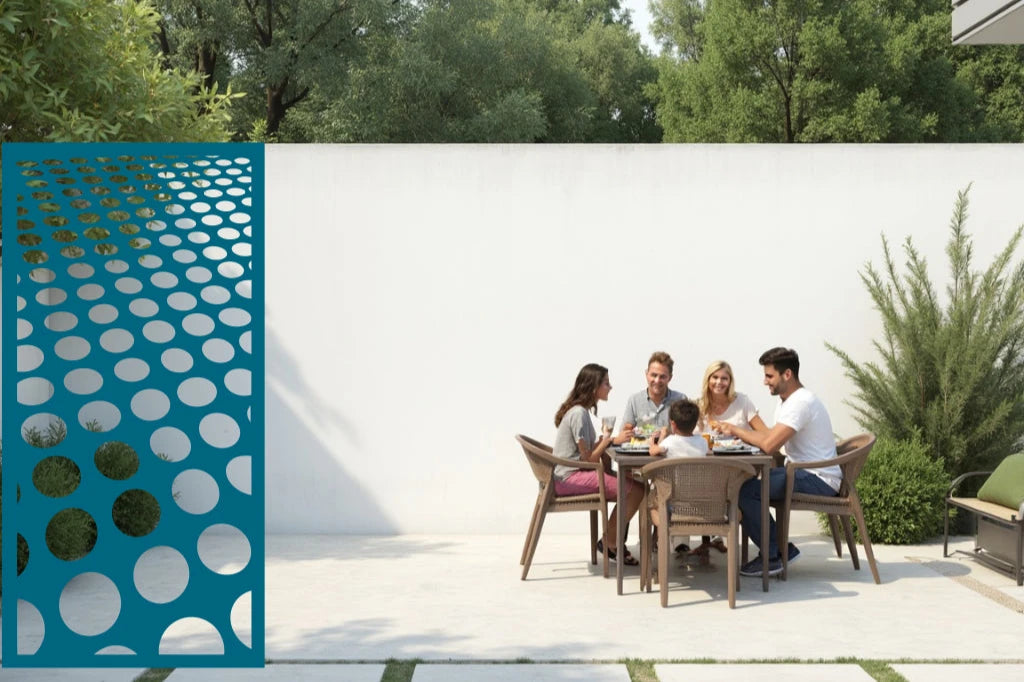 Stylish metal privacy screen featuring circular cut-outs in a gradient pattern, coated in Wedgwood Satin, blending aesthetics and function in an outdoor family area.