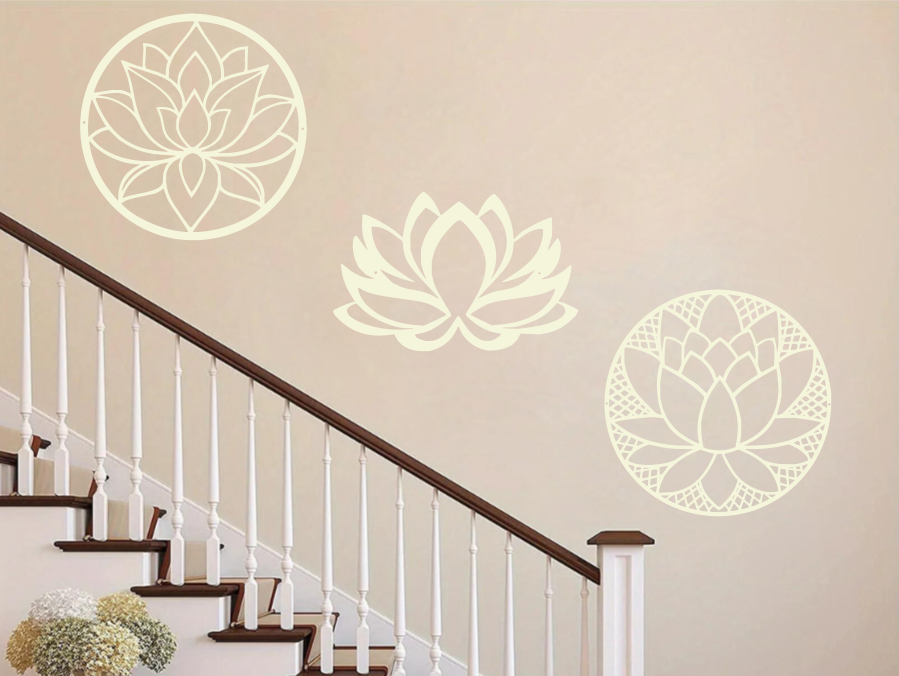 A three-piece metal wall art set featuring lotus flower designs, each uniquely crafted with geometric patterns and finished in Canola Cream powder coating. The set is mounted on a staircase wall, adding an elegant and serene touch to a classic interior space.