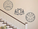 A three-piece metal wall art set featuring lotus flower designs, each uniquely crafted with geometric patterns and finished in Berry Grey Gloss powder coating. The set is mounted on a staircase wall, adding an elegant and serene touch to a classic interior space.