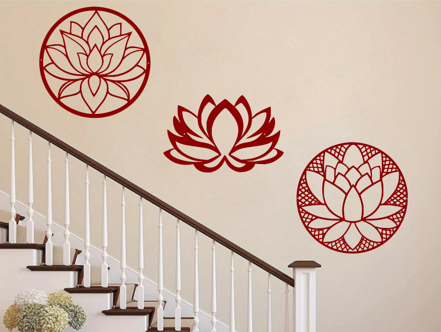 A three-piece metal wall art set featuring lotus flower designs, each uniquely crafted with geometric patterns and finished in Manor Red powder coating. The set is mounted on a staircase wall, adding an elegant and serene touch to a classic interior space.