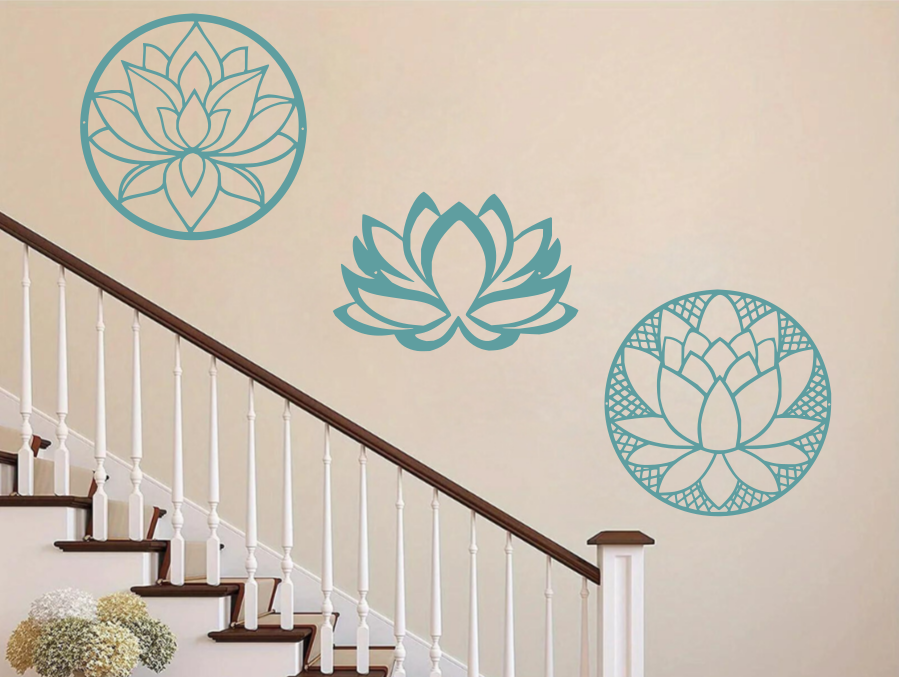 A three-piece metal wall art set featuring lotus flower designs, each uniquely crafted with geometric patterns and finished in Wedgwood Satin powder coating. The set is mounted on a staircase wall, adding an elegant and serene touch to a classic interior space.