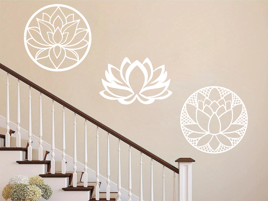 A three-piece metal wall art set featuring lotus flower designs, each uniquely crafted with geometric patterns and finished in Bright White Gloss powder coating. The set is mounted on a staircase wall, adding an elegant and serene touch to a classic interior space.