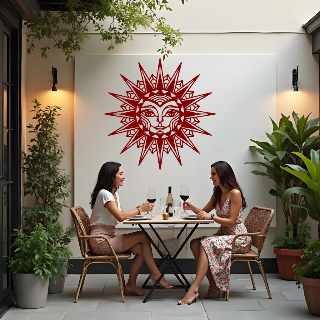 Celestial Majesty metal wall art in Manor Red, combining bold red hues with an elaborate sunburst design to create a statement piece for any room or patio.