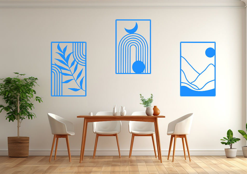 A three-piece minimalist geometric metal wall art set featuring abstract shapes, including a leaf design, a rainbow with moon and sun, and a mountain landscape, all finished in Blaze Blue Gloss powder coating. The artwork is mounted on a dining room wall above a simple wooden table with white chairs, bringing a modern and artistic touch to the space.