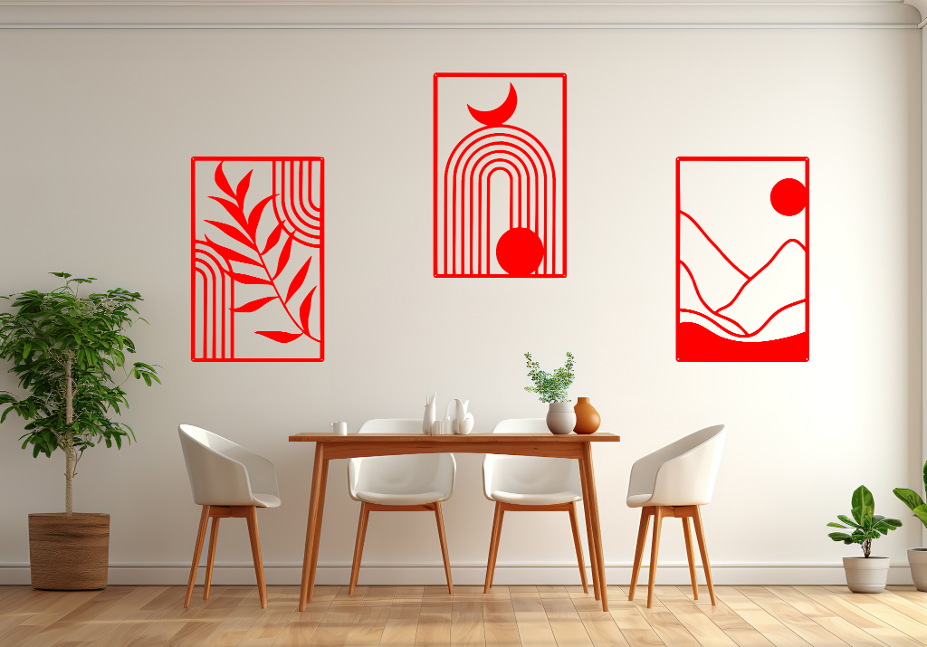 A three-piece minimalist geometric metal wall art set featuring abstract shapes, including a leaf design, a rainbow with moon and sun, and a mountain landscape, all finished in Signal Red powder coating. The artwork is mounted on a dining room wall above a simple wooden table with white chairs, bringing a modern and artistic touch to the space.