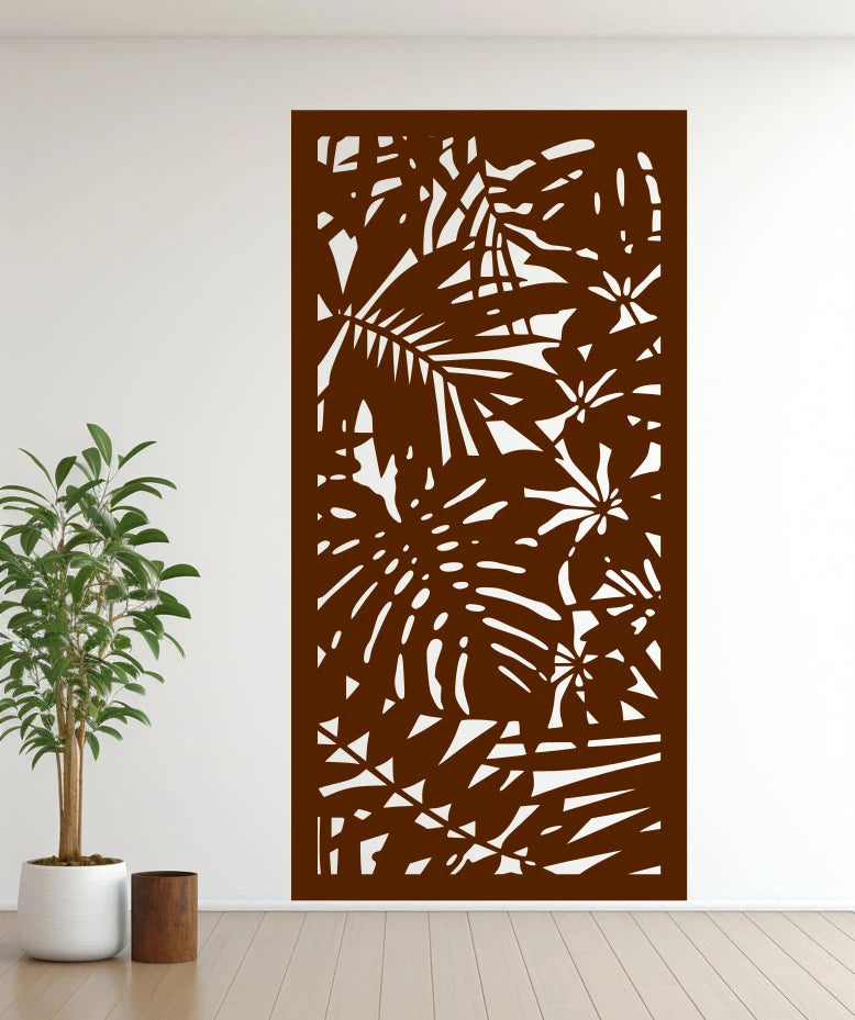 Metal privacy screen titled 'Nature,' featuring a detailed cutout of abstract botanical elements, finished in Rust Patina powder coating. The screen is mounted on an indoor white wall, lending a rustic and industrial flair to the space.