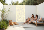 Oasis Dream privacy screen in Canola Cream, with soft floral patterns adding a warm, inviting feel to outdoor spaces, ideal for enhancing both privacy and visual appeal in your garden or patio.