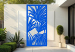 Oasis Veil privacy screen in Blaze Blue Gloss, showcasing tropical leaf patterns in a vibrant blue, perfect for bringing both bold color and functional privacy to your patio or garden.